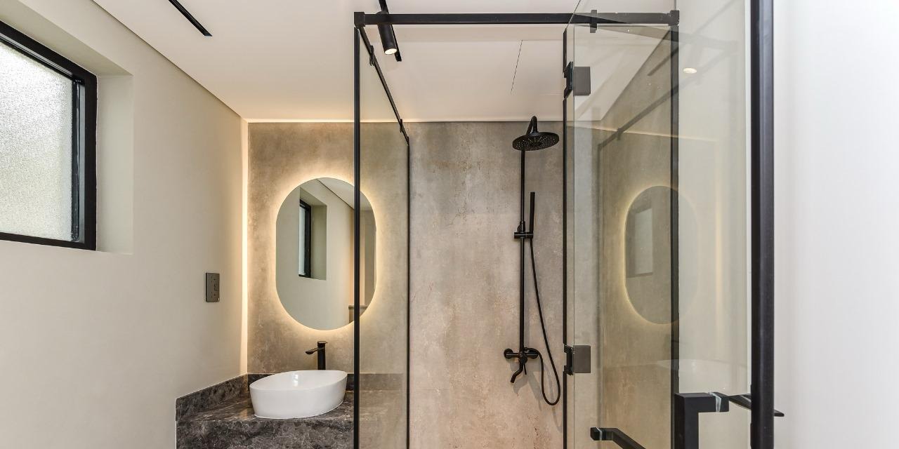 Renovated shower room with microcement walls at the Lime Tree Valley villa