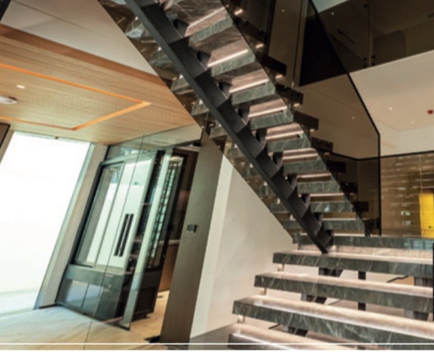 Double-height staircase atrium at a Sanctuary Falls villa, Jumeirah Golf Estates