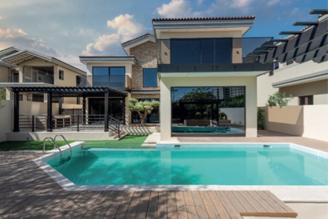 Pool terrace and rear elevation of a Sanctuary Falls villa, Jumeirah Golf Estates
