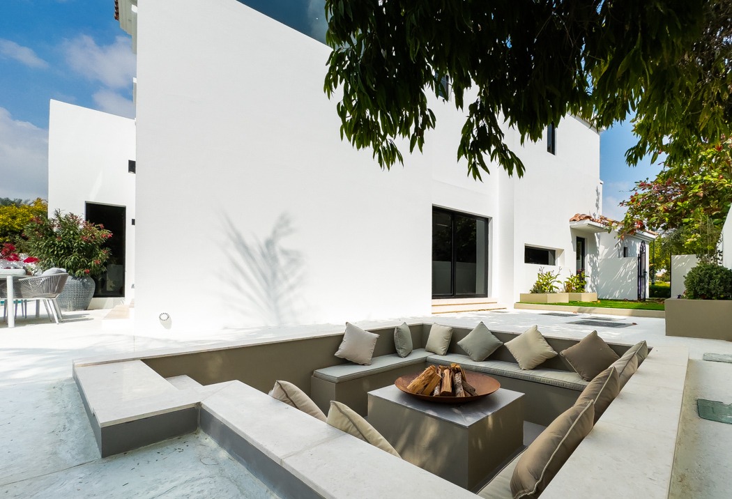 Sunken fire-pit seating terrace at the Lime Tree Valley villa, Jumeirah Golf Estates