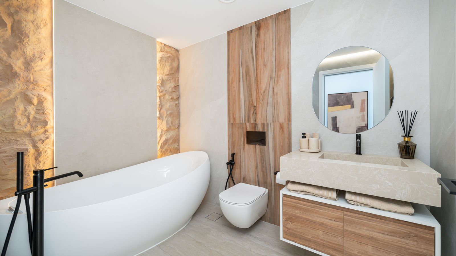 Bathroom with freestanding tub and stone feature wall at Emaar Beachfront