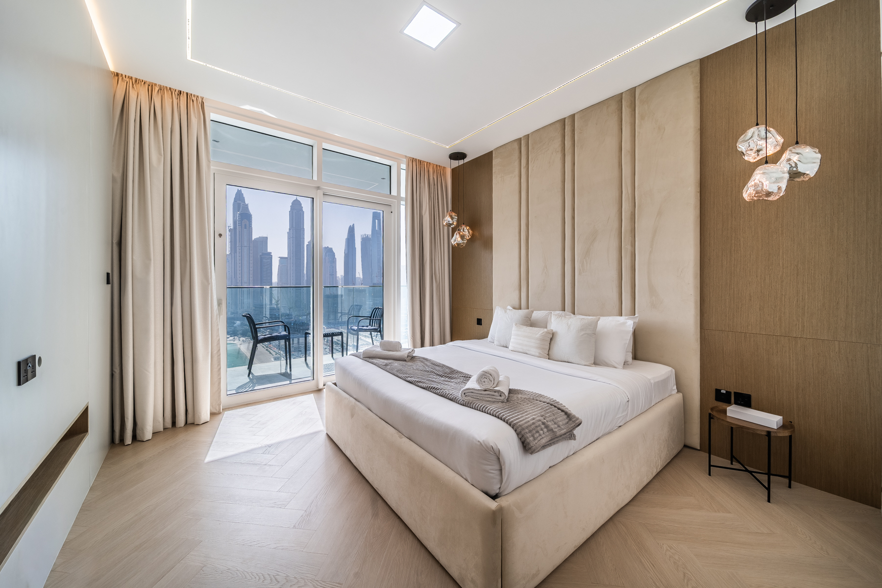 Master bedroom with balcony and Dubai Marina skyline at Emaar Beachfront