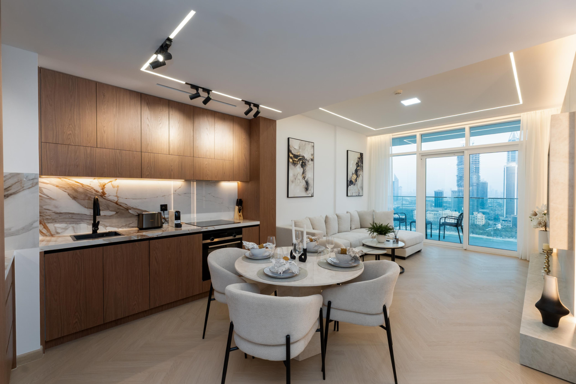 Open-plan kitchen, dining and living space with marina view at Emaar Beachfront