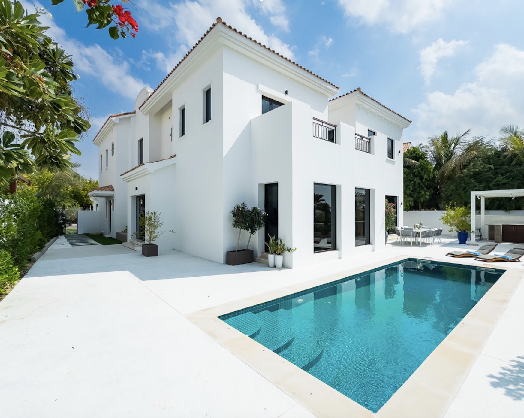 Pool and rear elevation of the renovated Lime Tree Valley villa, Jumeirah Golf Estates